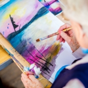 a resident painting during arts and crafts Activities for Elderly in Penylan House Nursing Home